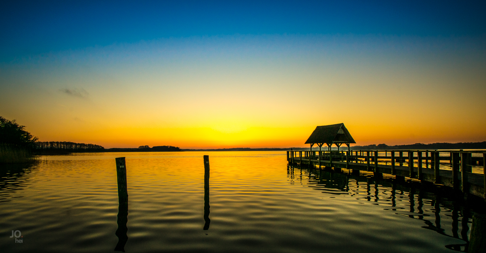 Sonnenaufgang am Hemmelsdorfer See mit Steg - Schleswig Holstein