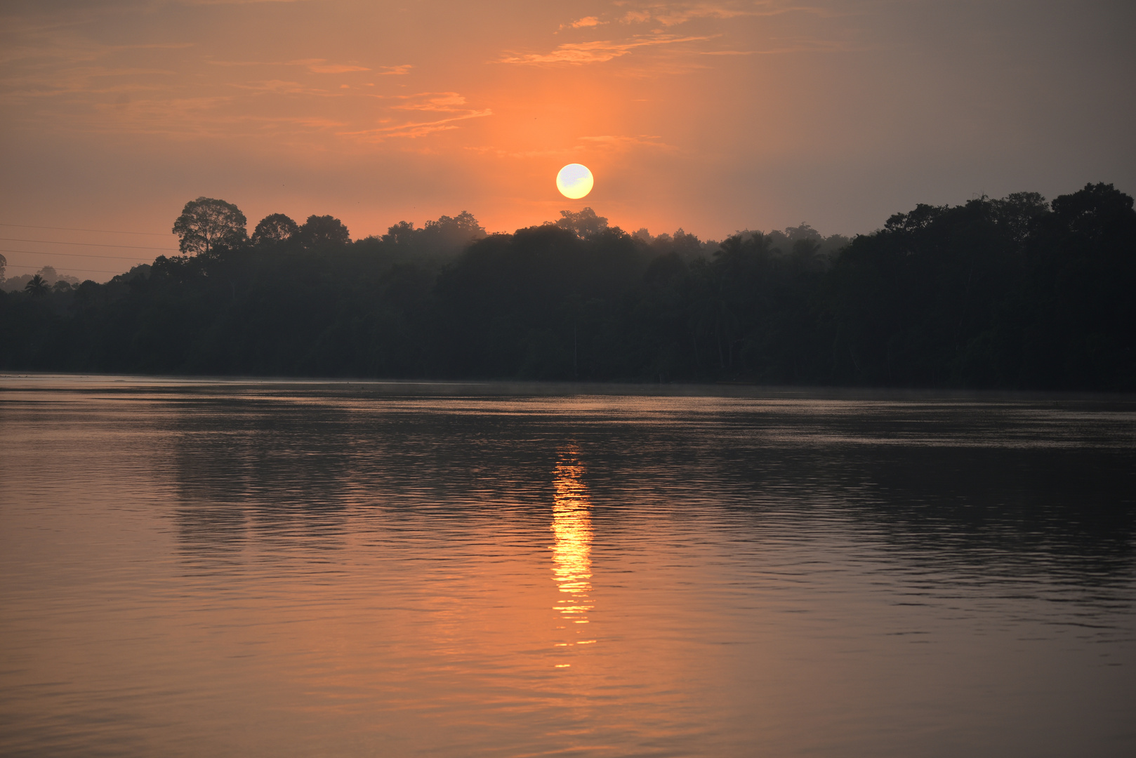 Sonnenaufgang am Kinabatangan-Fluss, Borneo