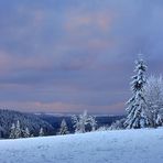 Sonnenaufgang hinter Schneewolken