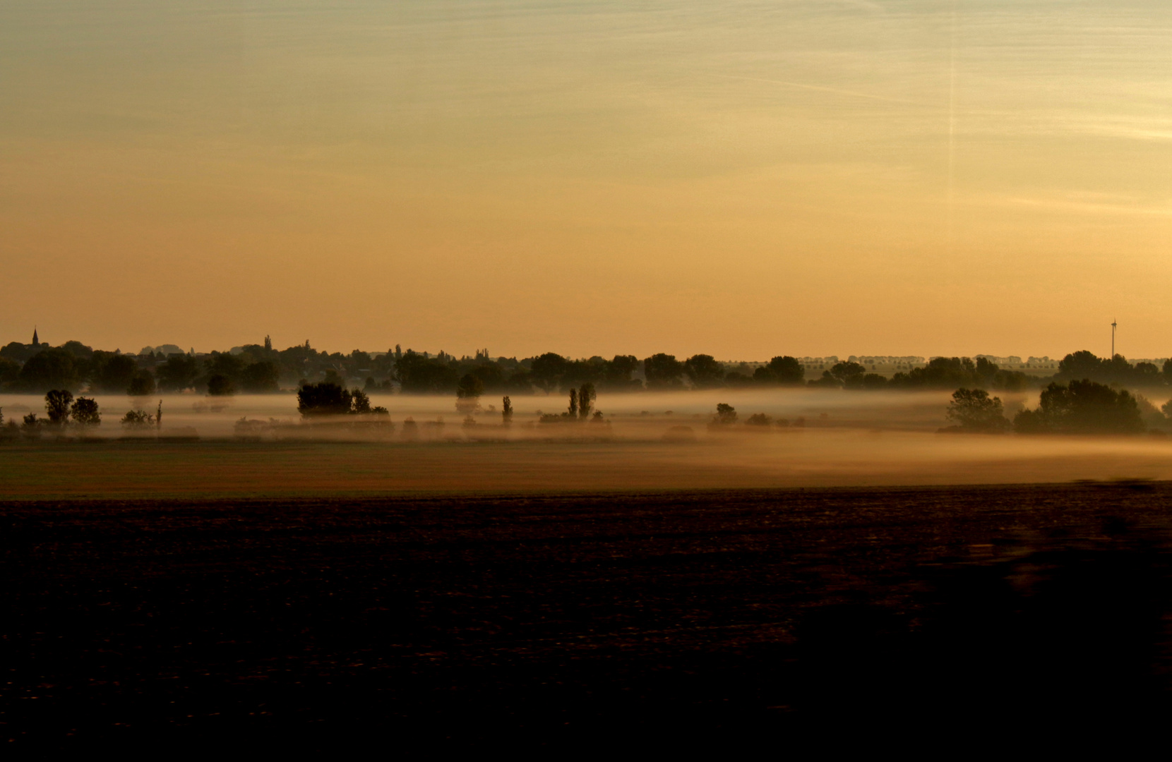 Sonnenaufgang mit Nebelschwaden  am Morgen