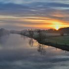 Sonnenaufgang mit Wolken und Nebel 