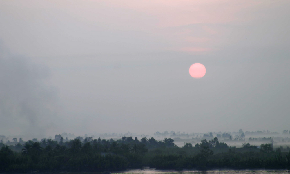 Sonnenaufgang über dem Saigon River