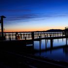 Sonnenaufgang über den Hafenanlagen am Chiemsee