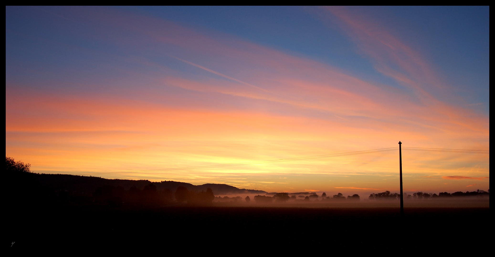 Sonnenaufgang über der Donauebene