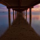 Sonnenaufgang unter dem Pier