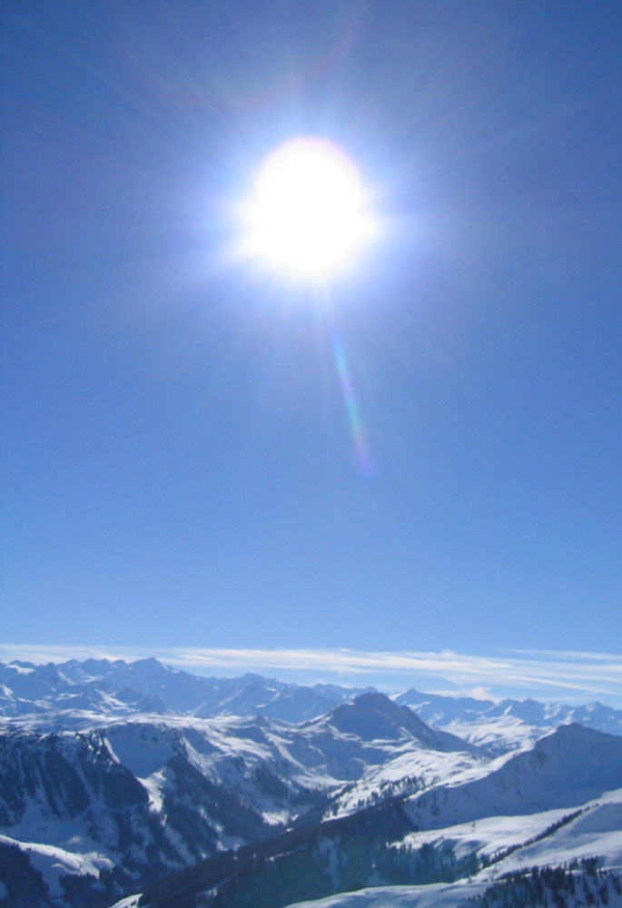 sonnenball über kitzbüheler alpen