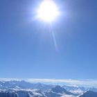 sonnenball über kitzbüheler alpen