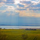 Sonnenstrahlen durchdringen die Wolken