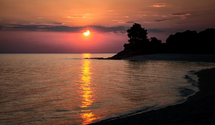 Sonnenstrahlen küssen das Meer
