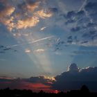 Sonnenstrahlen und Wolken