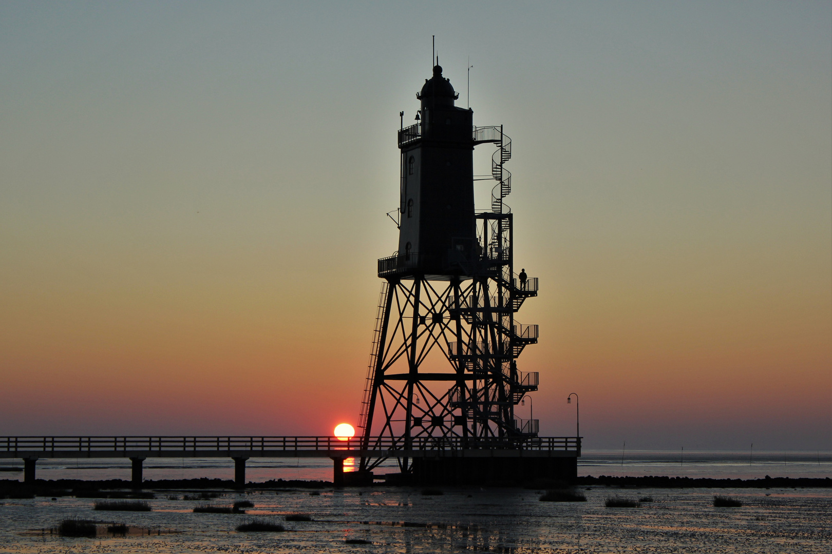 Sonnenuntergang am Leuchtturm von Dorum