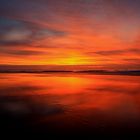 Sonnenuntergang am schwarzen Strand