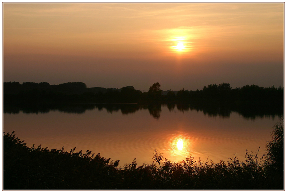 Sonnenuntergang am See von Holger Bürgel