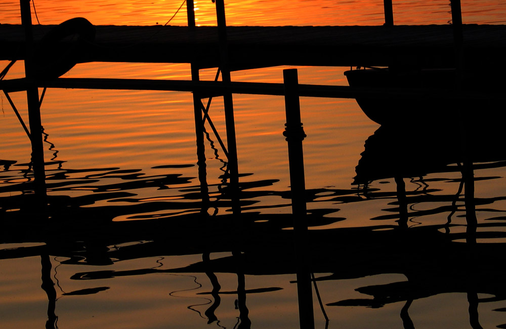 SONNENUNTERGANG AM STEG