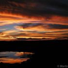 Sonnenuntergang am Wasserloch