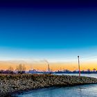 Sonnenuntergang an der Walsumer Rhein Aue mit Blick auf die STEAG