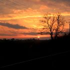 Sonnenuntergang auf der Landstraße