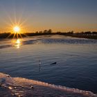 Sonnenuntergang bei Eis und Wasser im Ochsenmoor