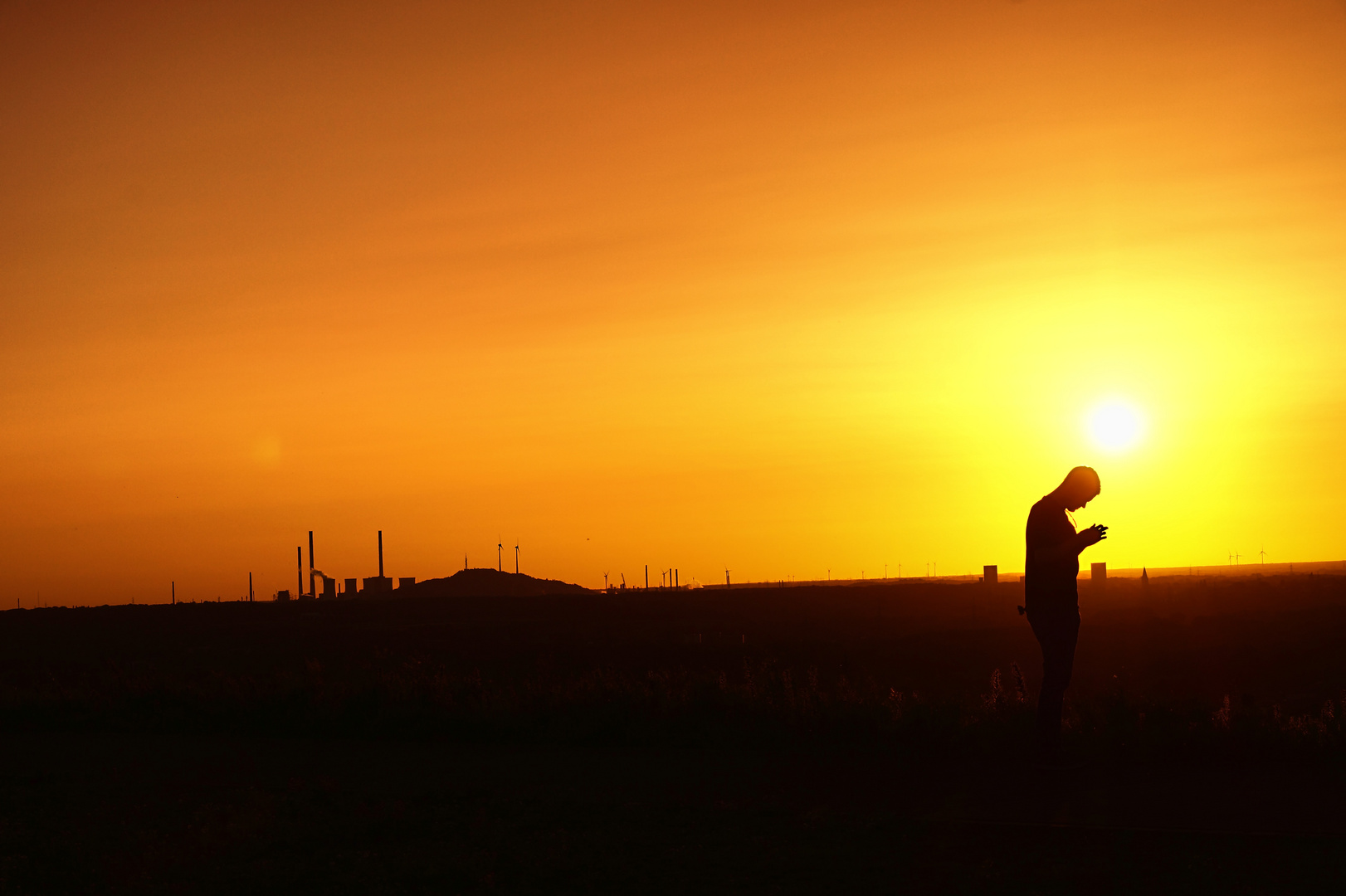 Sonnenuntergang Halde Hoheward mit Blick auf Halde Scholven