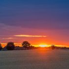 Sonnenuntergang hinter sanften Hügeln1