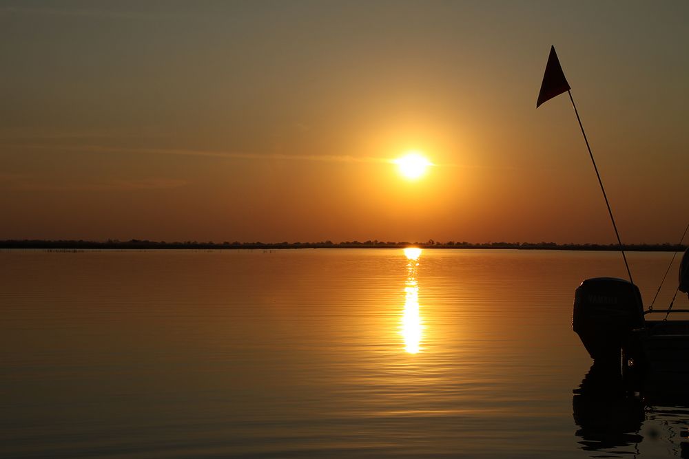 sonnenuntergang im Okavango