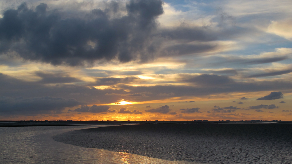 Sonnenuntergang im Watt der Nordsee