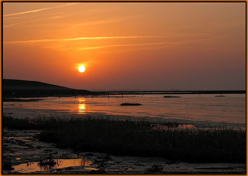 Sonnenuntergang im Wattenmeer