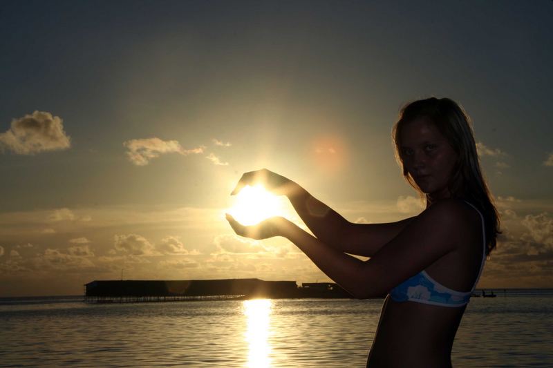 Sonnenuntergang in der Hand festhalten