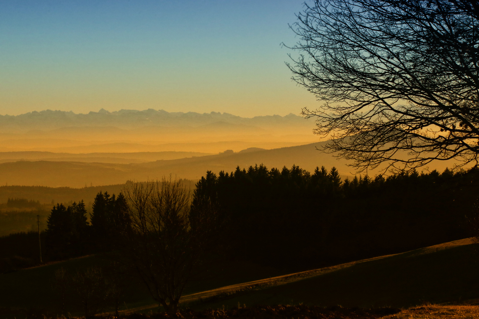 Sonnenuntergang mit Alpensicht