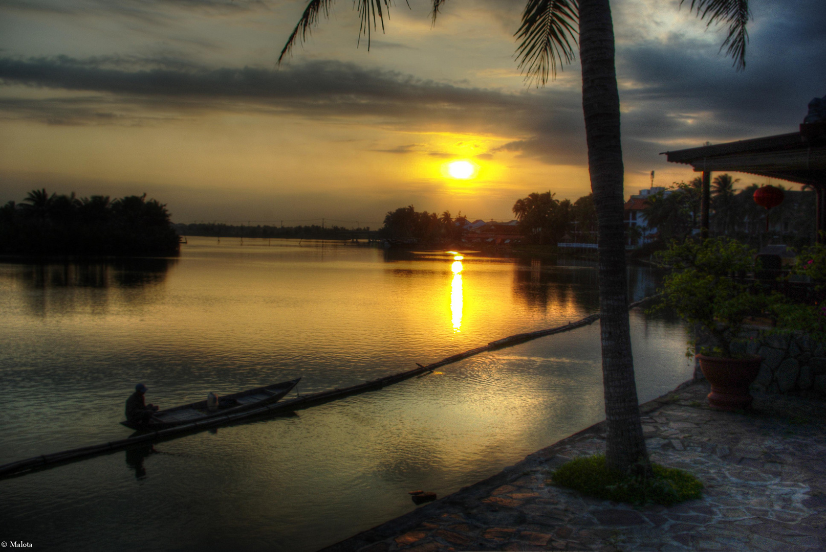 Sonnenuntergang mit Fischer in Hoi An, Vietnam