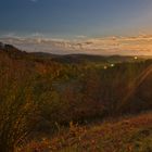 Sonnenuntergang mit Herbstlaub bei Bühle