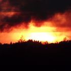 Sonnenuntergang mit Rauchwolken vom Osterfeuer