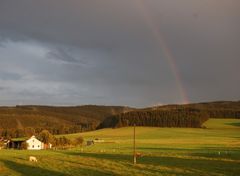 Sonnenuntergang mit Regenbogen