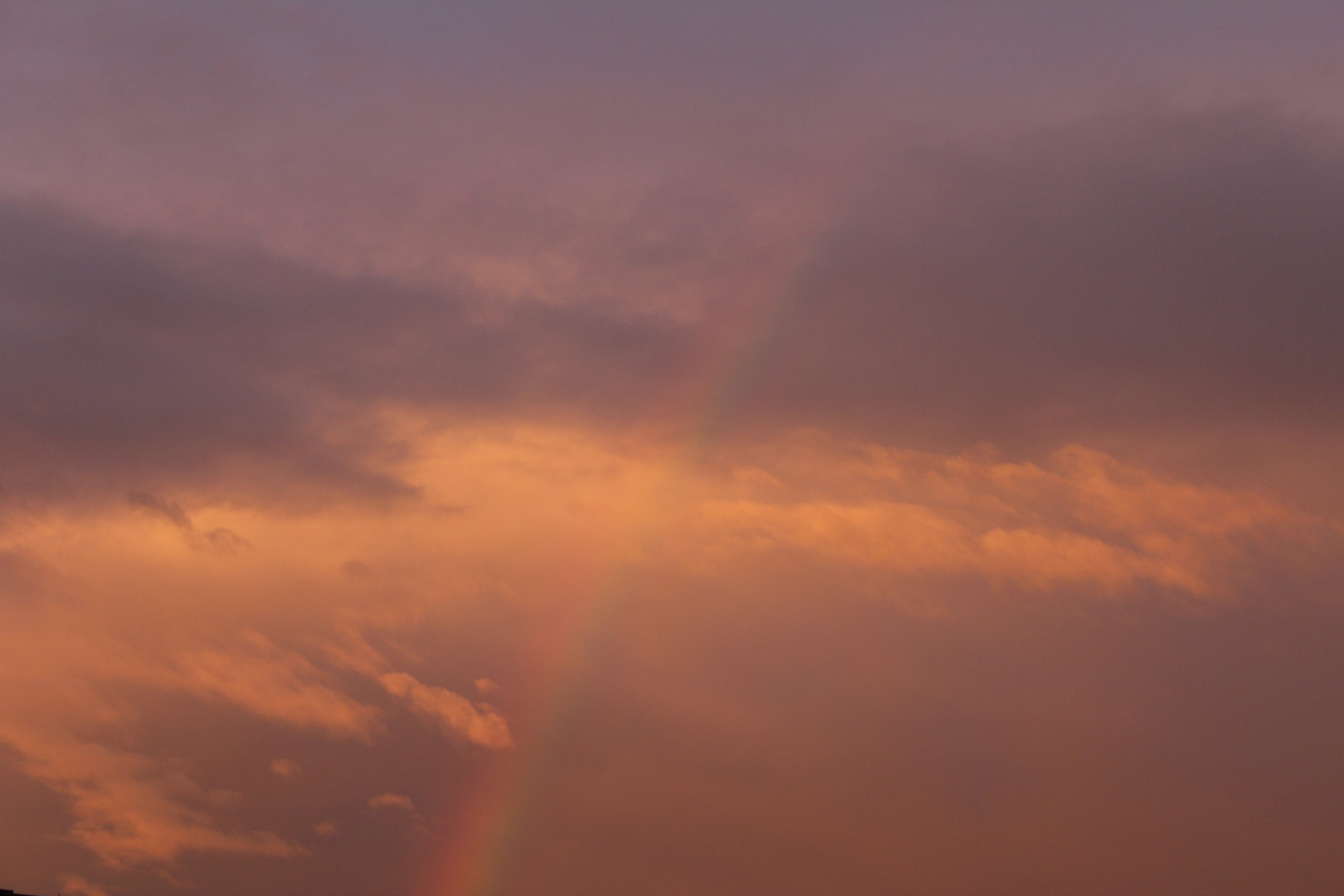 Sonnenuntergang mit Regenbogen