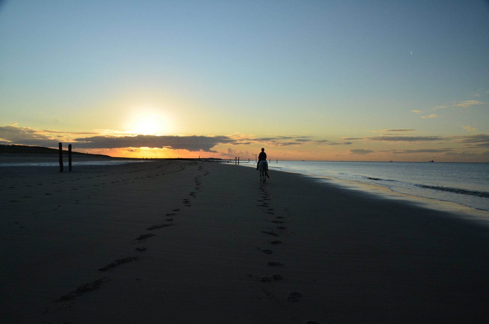 Sonnenuntergang mit Reiterin