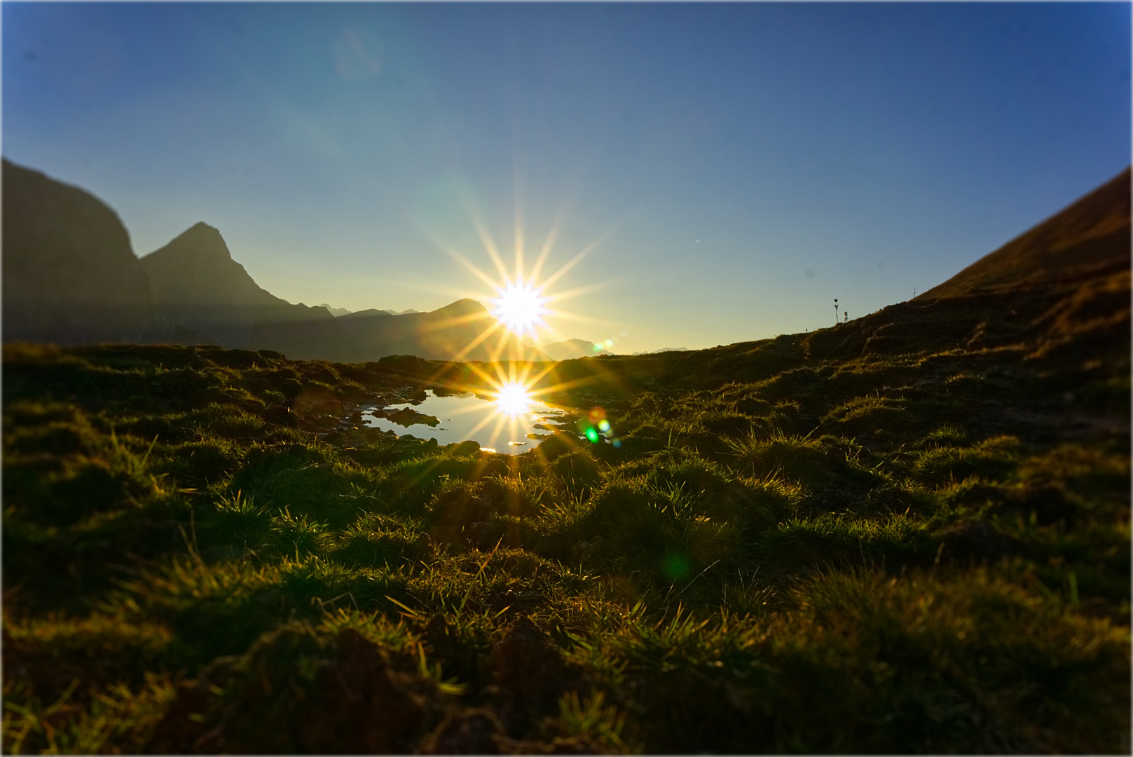 Sonnenuntergang mit Spiegelung im Lechtal