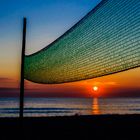 Sonnenuntergang mit Volleyballnetz