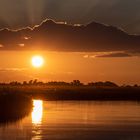 Sonnenuntergang über dem Okawango - III