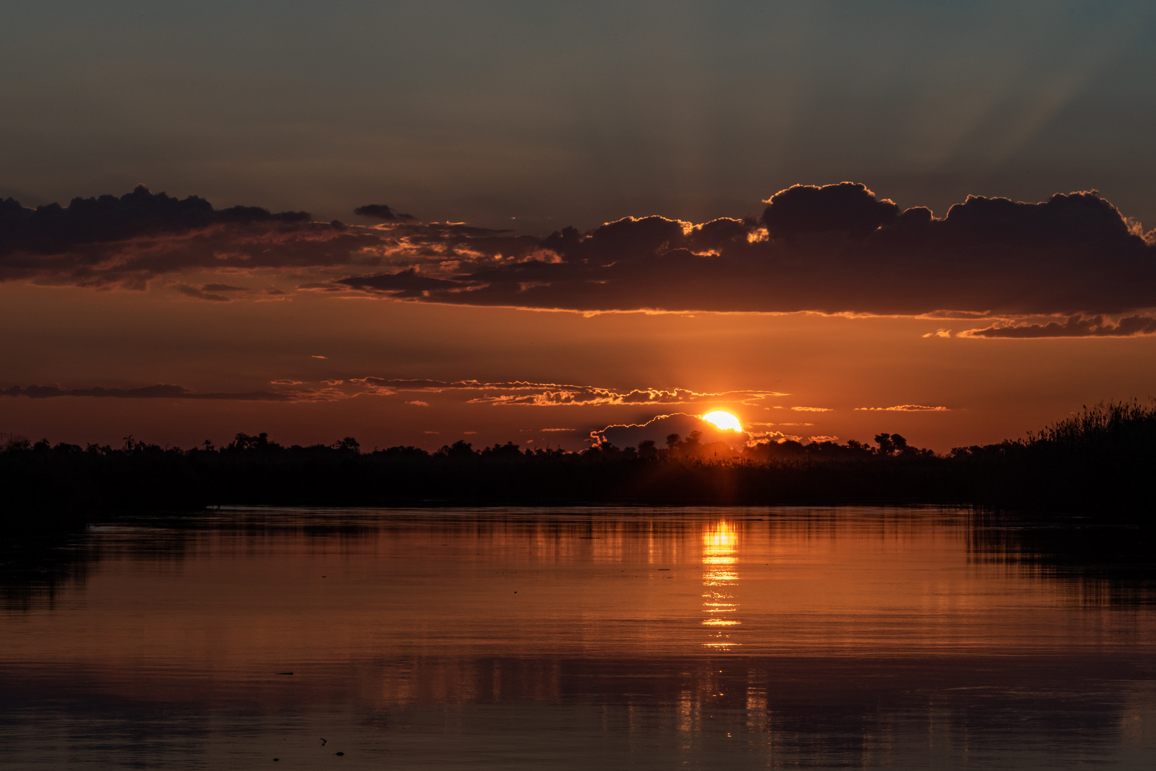 Sonnenuntergang über dem Okawango - IV