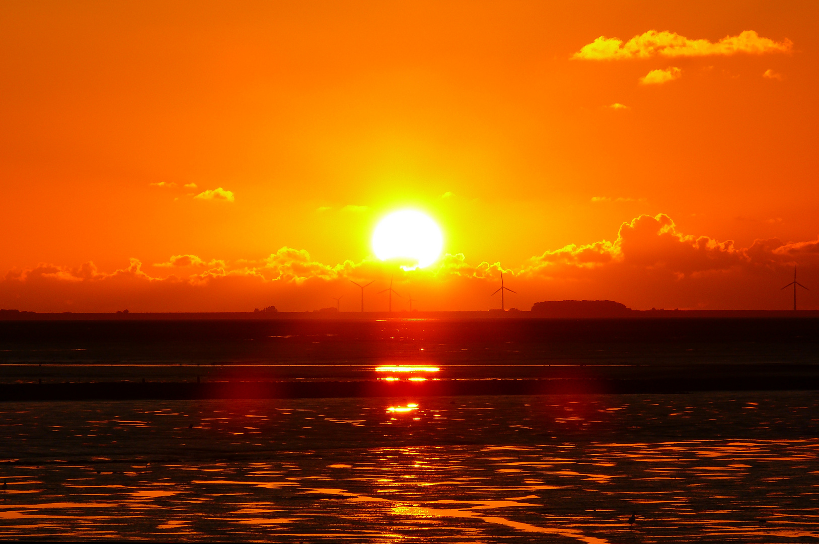 Sonnenuntergang über dem Watt bei Nordstrand