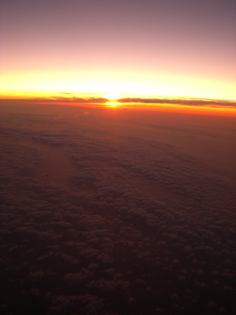 Sonnenuntergang über den Wolken