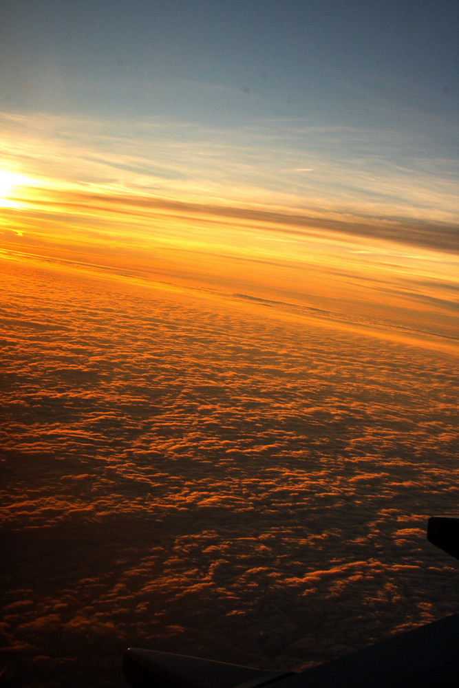 Sonnenuntergang über den Wolken