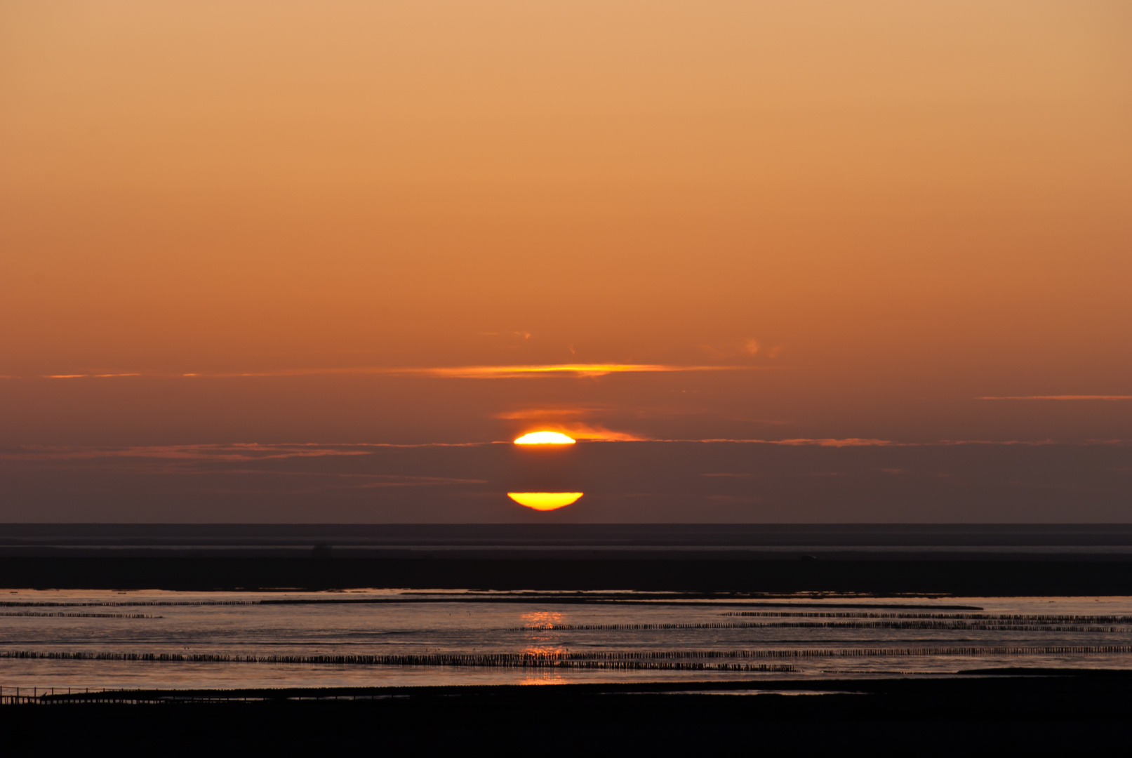 Sonnenuntergang über der Nordsee bei Schobüll (Husum), Blickrichtung Nordstrand