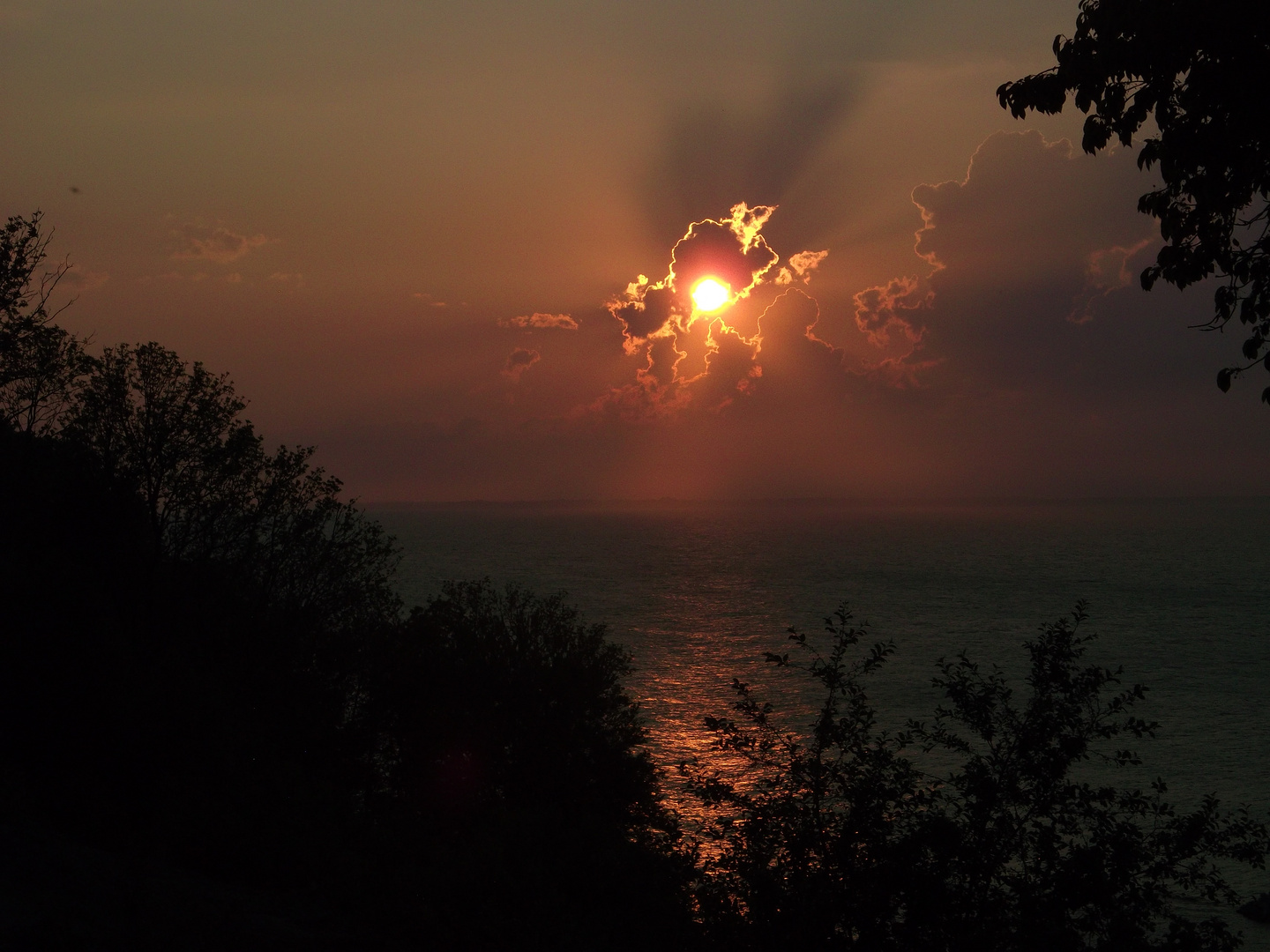 Sonnenuntergang über Kap Arkona von Lohme aus gesehen