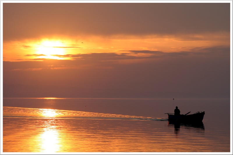 Sonnenuntergang und der Fischer