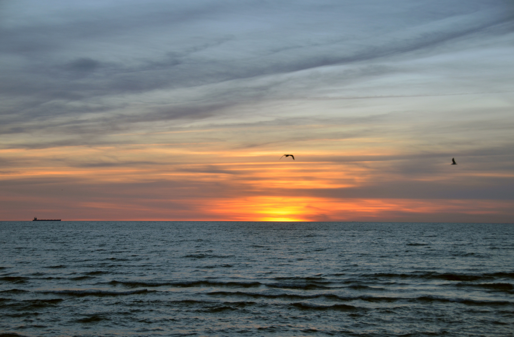 Sonnenuntergang vor Warnemünde