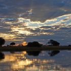 Spiegelung mit Sonnenuntergang