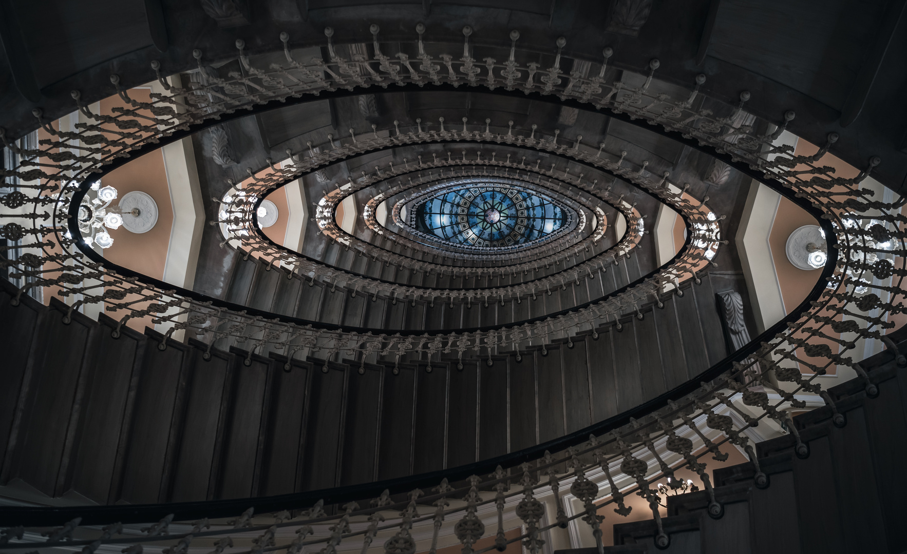 Spiral staircase with chandeliers