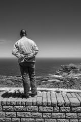 Standing on the wall of the bay