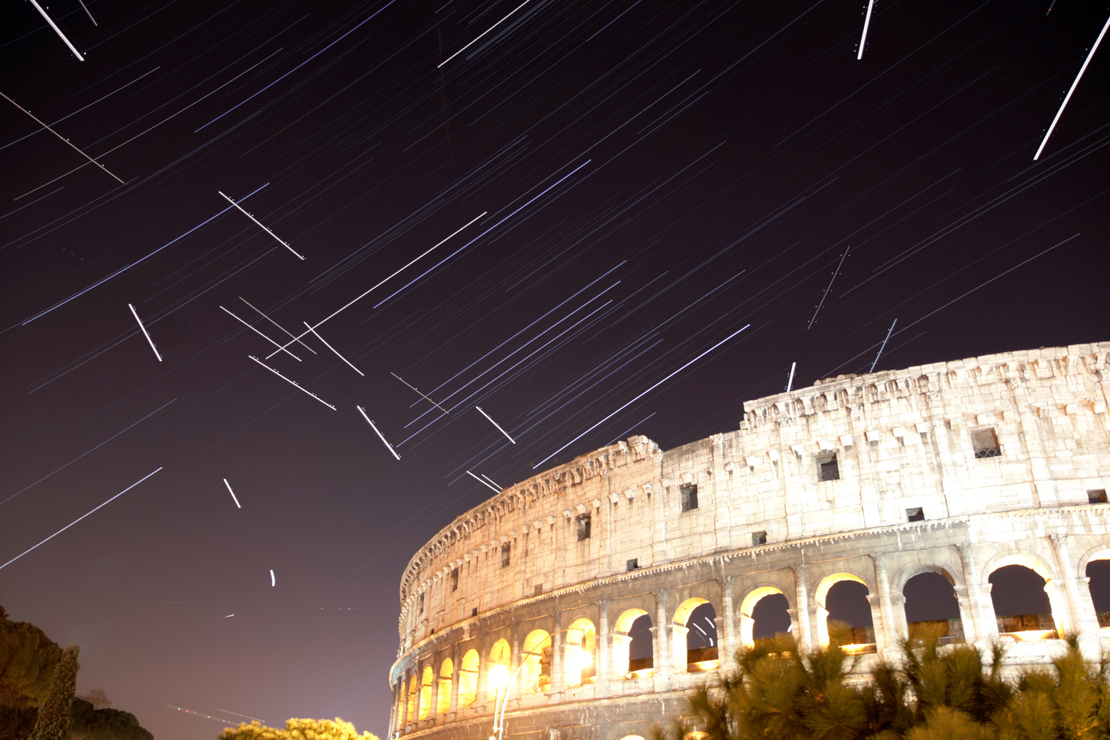 Stars and airplanes above the Colosseum